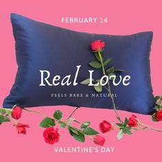 a blue pillow with red roses on it and the words real love