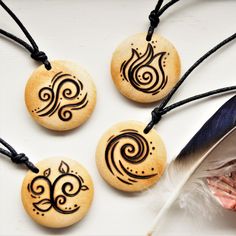 Beautiful wood burning rustic necklace featuring a choice of each of the 4 elements; earth, air, fire and water symbols.  These magical charm chokers are designed for both men and women and make great spiritual gifts for friends & family. Handmade art jewellery of the classical elements, choose which of the four nature temperaments are suitable for the recipient so they can wear their everyday necklace and feel inspired. Necklace Features: - Freehand wood burning, made to order - Unisex - 3cm di Water Symbols, Water Symbol, Earth Air Fire Water, Witch Pendant, Elements Earth, Wiccan Necklace, Element Necklace, Rustic Necklace, Fire And Water