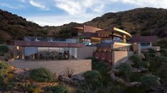 a modern house on the side of a mountain