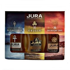 three bottles of jura on display in a box