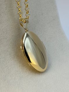 "14k Gold oval locket Necklace about 9.29 gr , 22 \", 3mm Priced to sell! Compare our prices to other similar sellers! Arrives in a GIFT BOX and includes FREE SHIPPING within the USA and Canada. International shipping is available at the most economical rates on ETSY. I HAVE BEEN IN THE JEWELRY BUSINESS ALL MY LIFE. I am a second -generation family member making gold and jewelry. Please feel free to ask me any questions - Always happy to help! Fast Replies to messages! Superior Quality and Best Prices!" Gold Oval Link Locket Necklace For Anniversary, Classic Gold Locket Necklace For Gift, Classic Pendant Locket Necklace For Gift, Classic Pendant Locket Necklace As Gift, Round Hallmarked Locket Necklace Gift, Classic Pendant Locket Necklace Gift, Round Locket Necklace With Charms For Anniversary, Gold Locket Necklace With Charms For Memorial, Hallmarked Round Pendant Locket Necklace Gift