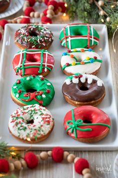 decorated doughnuts on a platter with christmas decorations