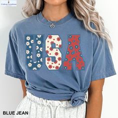 floral 4th of july shirt, fourth of july shirt flowers ,  july 4th shirt, 4th of july, july 4th, america shirt, 4th of july shirts, 4th of july tshirt, american flag shirt, COMFORT COLORS - ADULT UNISEX - (1717, 6014) 6.1 oz./yd² (US), 10 oz/L yd (CA), 100% ring spun cotton, 20 singles Garment dyed for that lived in feel and almost no shrinkage at home. Soft ring spun cotton fabric with 100% cotton threads Relaxed fit Topstitched, classic width, collar Twill taped neck and shoulders for comfort and durability Rib cuffs Shoulder to shoulder twill tape Signature twill label Made With Respect Proud member of the U.S. Cotton Trust Protocol Made with OEKO-TEX certified low-impact dyes Our clean pigment dye colors are salt free This product meets the following Sustainable Style subcategories: Su 4th Of July Shirts, July Fourth, Salt Free, Fourth Of July Shirts, Dye Colors, Patriotic Shirt, 4th Of July Shirt, Usa Shirt, American Flag Shirt