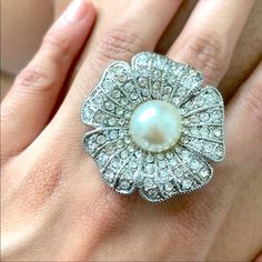 One Size, Stretchable Flower Ring With Zirc Diamonds And A Center Pearl. Perfect Condition, As Pictured. Flower Shaped Pearl Ring For Wedding, Elegant White Adjustable Flower Ring, Adjustable Pearl White Flower-shaped Jewelry, White Flower Ring For Party, Pearl White Flower Jewelry For Party, Adjustable Flower Ring For Party, White Formal Jewelry For Spring, White Ring Jewelry For Spring, Elegant White Flower-shaped Pearl Ring