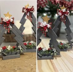 two christmas trees made out of wooden planks with bows and decorations on them, sitting on a table