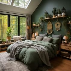 a bedroom with green walls and lots of plants