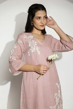 Blush pink anchor thread hand embroidered tunic featuring 3D embossed gold petal floral work. Paired with a pant. - Aza Fashions Spring Wedding Straight Kurta Top, Spring V-neck Kurta With Chikankari Embroidery, V-neck Kurta With Chikankari Embroidery For Spring, V-neck Tunic With Chikankari Embroidery For Spring, Pink V-neck Kurta For Spring, Elegant Resham Embroidery Tunic For Spring, Elegant Spring Straight Kurta Tops, Elegant Straight Kurta Tunic For Spring, Elegant Spring Tunic Straight Kurta