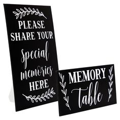 two black and white signs that say please share your special memories here, memory table