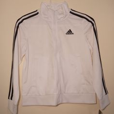 Adidas Boys' Extended Sizing Zip-Front Iconic Tricot Jacket White, Small 8-Plus, New White Sports Outerwear With Three Stripes Branding, White Adidas Track Jacket For Winter, Adidas White Track Jacket For Winter, Adidas White Winter Track Jacket, Hooded Outerwear With Three Stripes For Fall, Fitted Three Stripes Outerwear For Fall, Fitted Outerwear With Three Stripes For Fall, Long Sleeve Outerwear With Three Stripes For Spring, Cotton Outerwear With Three Stripes For Fall