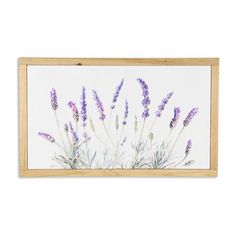 lavender flowers are displayed in a wooden frame