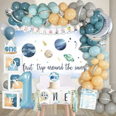 a space themed birthday party with balloons and decorations