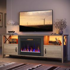 an entertainment center with a television and fireplace