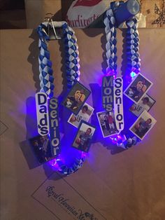 several blue and white lanyards with pictures on them