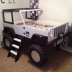 an off - road vehicle is parked in the corner of a room