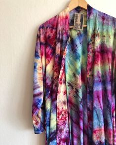 a colorful shirt hanging up on a wall