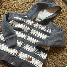 Seven Baby Blue White Striped Zip Up Hoodie Size 12m Light Wear Cotton Playtime Hoodie Outerwear, Cotton Hoodie For Playtime In Fall, Cotton Hoodie With Adjustable Hood For Playtime, Cotton Hoodie Sweatshirt For Playtime, Gray Tops For Winter Playtime, Gray Winter Tops For Playtime, Blue Cotton Hoodie For Playtime, Casual Hoodie Top For Playtime, White Cotton Hoodie For Playtime