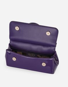 Small patent leather Sicily bag: Purple Front flap with hidden double magnetic fastening Logo tag featuring two metal plating finishes Top handle and adjustable, detachable strap in patent leather Printed fabric lining and flat pocket Item comes with a branded dust bag Measurements: 13 x 19 x 6 cm Made in Italy Luxury Leather Shoulder Bag With Glossy Finish, Designer Patent Leather Bag With Glossy Finish, Luxury Patent Leather Bags For Formal Occasions, Luxury Glossy Finish Top Handle Bags, Luxury Bags With Glossy Finish For Formal Occasions, Luxury Glossy Formal Bags, Luxury Glossy Finish Formal Bags, Designer Patent Leather Bag With Detachable Strap, Everyday Patent Leather Bag With Detachable Handle