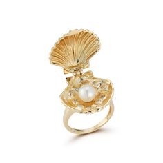 14kt Lady Venus Ring This divine ring, the Lady Venus, birth of a pearl is inspired by the work of the artist, Sandro Botticelli. Pearls are a signature of the brand. It was only natural to explore the origins of this beautiful gemstone. 14kt Yellow Gold 9.75gm Gold 0.145ct Diamonds 6mm Cultured Pearl 20mm Width Snap lock closure Made in New York City Venus Ring, Art Coquillage, Surf Jewelry, Sandro Botticelli, Mermaid Ring, Jewelry Accessories Ideas, Dope Jewelry, Jewelry Lookbook, Girly Jewelry