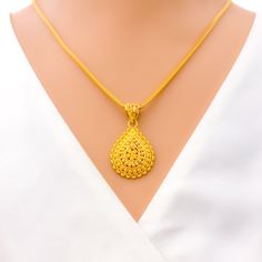 The Radiant Bold Pendant Set is expertly crafted from 22k yellow gold, weighing 8.1 grams, symbolizing luxury and strength. It features a 1.4-inch pendant and 0.6-inch earrings, each with secure screw-back posts, completing this three-piece set. Ideal for those who seek standout pieces, this ensemble blends bold design with classic elegance, perfect for enhancing any attire with its striking presence. PRODUCT DETAILS Gold Purity(karat): 22k Gold Weight(grams): 8.1 Item Finish: Yellow Gold Pendant Length: 1.4" Matching Earrings: Included Earring Length: 0.6" Earring Post: Screw Back Number Of Pieces: 3 Chain: Not Included Yellow 22k Gold Hallmarked Jewelry, 22k Gold Locket Jewelry, Festival Yellow Gold Jewelry With Large Pendant, 22k Yellow Gold Amulet Jewelry, Gold Filigree Teardrop Pendant Jewelry, Hallmarked 22k Gold Teardrop Jewelry, Traditional Yellow Teardrop Jewelry, Yellow 22k Gold Round Pendant Jewelry, 22k Gold Teardrop Jewelry Gift