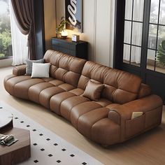 a large brown leather couch sitting in a living room