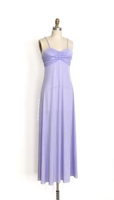 vintage dress  Era: 1970's Label: The House of Nu-Mode. Toronto Canada. Marked size: vintage 9/10 Material: nylon/poly jersey (semi sheer) Closure: back zip Colour: pastel purple  Details: timeless Nu-Mode maxi dress silhouette, comfy and slightly stretchy jersey fabric, fitted bodice with a gathered sweetheart style bust, comfortable spaghetti straps, empire waist, maxi a-line skirt Fits like: small Bust: 31 - 35" Waist: 31" Hips: 42" Length: 57" Condition: An as is, as found beauty. There are Joanna Newsom, Colour Pastel, Violet Pastel, Jersey Maxi Dress, Purple Details, Maxi Jersey Dress, Skirt Fits, Pastel Purple, Dress Silhouette