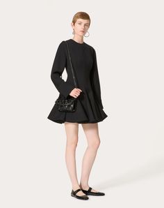 Short Dress in Luxury Crepe - Rear zip closure - Luxury Crepe (100% Virgin Wool) - Habotai Lining - Length: 87 cm / 34.2 in. from the shoulders in an Italian size 40 - Sleeve length: 87 cm / 34.2 in. from the centre back in an Italian size 40 - The model is 176 cm / 5'9" tall and wears an Italian size 40 - Made in Italy The look of the model is completed by a Valentino Garavani Locò Bag and Valentino Garavani Shoes. Crepe Short Dress, Couture Perfume, Woman In Black, Studded Sneakers, Valentino Garavani Shoes, Oxford Boots, Wedge Loafers, Dress For Woman, Crepe Dress