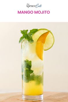 a tall glass filled with lemonade and lime