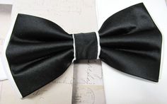 "Beautiful silk pre tied and adjustable double tiered banded bow tie. Will adjust from 13\" through 20\" neck. Bow dimensions 2.5\" x 4.5\"." Tuxedo Style Bow Tie Back Ties For Wedding, Black Bow Tie Back Ties For Wedding, Adjustable Black Ribbon Bow For Black Tie Events, Black Suit And Tie Accessories For Wedding, Adjustable Black Bow For Wedding, Classic Black Ribbon Bow Tie For Wedding, Black Tuxedo Ties For Wedding, Black Satin Bow Ties For Wedding, Standard Tie Bow With Ribbon For Black-tie Events