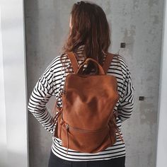 This stunning backpack is made of genuine soft nappa leather in a soft and distressed Honey Brown color.With enough room for all your daily essentials, It is perfect for everyday use, as well as for laptops of all sizes, IPAD, A4 files, books and travel. it as a unique structured with a zipper closure at the top, and three outside zipper pockets for mobile, keys, etc.It is fully lined with black strong cotton fabric which I divide to two large interior, zip pocket, and a leather cell phone pocke Leather Softback Backpack With Zipper Closure, Casual Soft Leather Softback Backpack, Casual Softback Soft Leather Backpack, Soft Leather Softback Backpack For On-the-go, Brown Soft Leather Backpack For Daily Use, Daily Use Soft Leather Shoulder Backpack, On-the-go Soft Leather Softback Backpack, Everyday Leather Backpack With Large Capacity, Soft Leather Softback Backpack For Everyday Use