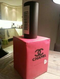 a chanel box sitting on top of a table in the middle of a kitchen