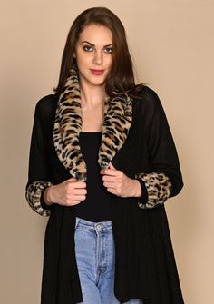 A unique black cable knit long-sleeved jacket crafted from a very soft fine wool. The look of this jacket is further elevated with a contrasting leopard fur collar and cuffs making it a stunning accessory that can be worn over any casual attire or to keep stylishly warm whilst traveling. Casual Attire, Collar And Cuff, Fur Collar, Fur Collars, Wool Jacket, Passion For Fashion, Summer Collection, Occasion Wear, Cable Knit