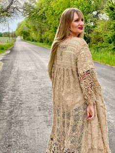 Embrace timeless fashion with The Dixieland Duster. This one-size crochet duster adds a statement piece to any outfit with its intricate details. Let your style shine with this must-have outerwear piece. model shown is a size 2/4, 5'6" tall and 34C bust fits sizes 2-18/20 very versatile in cut and fit 100% cotton Bohemian Lace Cardigan For Fall, Spring Bohemian Crochet Open Knit Dress, Lace Crochet Dress For Fall, Long Bohemian Crochet Dress For Spring, Fall Lace Outerwear With Open Front, Lace Open Front Outerwear For Fall, Fall Lace Open Front Outerwear, Fall Crochet Lace Dress With Long Sleeves, Fall Beige Crochet Dress