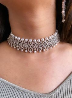 Luxury Tilla Choker For Gift, Luxury White Kundan Necklace For Wedding, Dazzling Diamond White Choker Necklace, Glamorous Round Pearl Jewelry, Elegant Pearl Embellished Choker Jewelry, Luxury Pearl Diamond Necklace For Wedding, Wedding Pearl Diamond Necklace, Elegant Diamond Choker For Wedding, Elegant Hand Set Silver Pearl Necklace