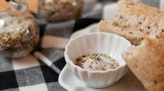 a plate with some bread on it and other food items in the bowl next to it