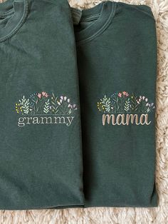 two personalized t - shirts sitting on top of a carpet