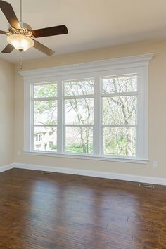 empty room with ceiling fan and hard wood floor in residential home for sale at bridgewater communities