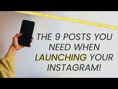 a person holding up a cell phone in front of a sign that says the 9 posts you need when launching your instagram