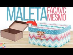 an open box sitting on top of a wooden table next to a cardboard box with the words maleta facavo mesmo