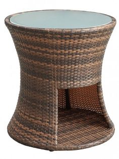 a brown wicker side table with glass top