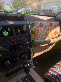 the interior of a car decorated with flowers and leaves