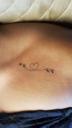 a woman's stomach with the word love written on it