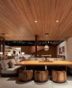 a large wooden table sitting in the middle of a living room