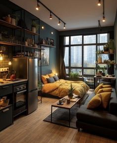 a living room filled with furniture next to a window and a refrigerator freezer sitting on top of a hard wood floor