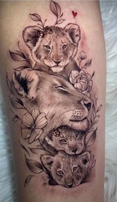 a tattoo with lions and roses on it