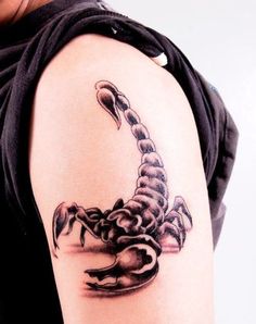 a woman with a scorpion tattoo on her arm