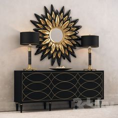 a black and gold sideboard with two lamps on it next to a wall mounted mirror