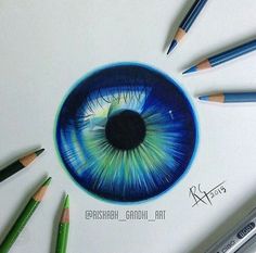 a drawing of an eye with colored pencils around it