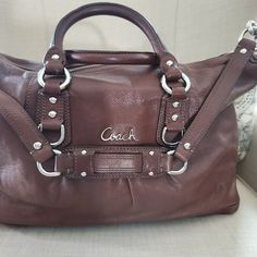 Coach Two Way Satchel Bag, Beautiful Chocolate Brown With Lavender Inside. Two Side Pockets With One Zipper Side Pocket. Handles Are Excellent, Corners Have Some Wear, Inside Has Some Blue Marks And Some Staining On The Bottom. Beautiful Leather Bag, Great Size! Silver Leather Tote Satchel, Coach Leather Satchel With Silver-tone Hardware, Silver Soft Leather Bag, Designer Silver Leather Bags, Silver Leather Satchel With Double Handle, Silver Leather Double Handle Satchel, Coach Leather Bag With Silver-tone Hardware, Silver Leather Satchel With Handles, Silver Leather Satchel For Shopping