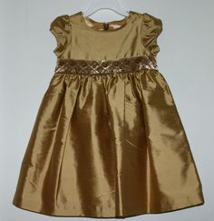 NWT Gymboree Prim and Proper gold silk dupioni dress.  Features a velvet sash that is hand-detailed with bugle beads and metallic stitching.  The dress is fully lined with a poly-satin lining.  Hidden back zipper.   A different size may be pictured to save some picture-taking time. Check out all my matching items in my listings and in my ebay store . I have a matching little sister dress listed in my ebay store.  All items come from a smoke free home. Payment is expected within 7 days. Serious b Fitted Satin Dress For Festive Occasions, Gold Dress With Fitted Bodice For Festive Occasions, Festive Fitted Dress For Dress-up Occasions, Festive Fitted Dress For Dress-up Events, Festive Fitted Dresses For Formal Occasions, Festive Fitted Party Dress, Elegant Short Sleeve Christmas Dresses, Festive Short Sleeve Dress-up Dress, Elegant Holiday Dress-up Dresses