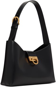 Polished calfskin shoulder bag in black. · Adjustable pin-buckle shoulder strap · Logo hardware at face · Foldover tab with flip-clasp closure · Zip pocket and patch pocket at interior · Calfskin lining · Gold-tone hardware · H7.5 x W12.5 x D3 in Supplier color: Nero On-the-go Shoulder Bag With Branded Hardware And Top Handle, Black Saffiano Leather Shoulder Bag With Gold-tone Hardware, Ferragamo Shoulder Bag, High-end Black Shoulder Bag With Gold-tone Hardware, Salvatore Ferragamo Shoulder Bag, Luxury Streetwear, Salvatore Ferragamo, Patch Pocket, Calf Skin